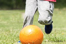 soccer ball being dribbled